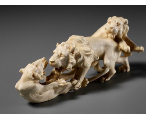 KOZAN: AN IVORY OKIMONO OF THREE FIGHTING LIONSBy Kozan, signed KozanJapan, Meiji period (1868-1912)Finely carved in openwork