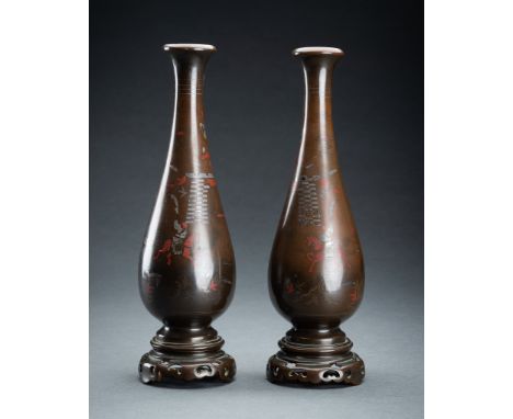 A PAIR OF VIETNAMESE SILVER INLAID BRONZE VASES, 19th CENTURYVietnam, late 19th century. Of elongated pear shape with slender