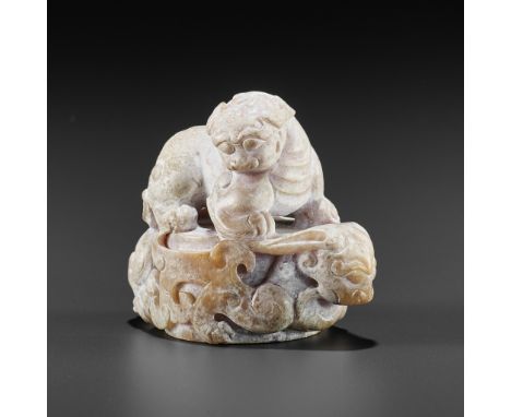 A JADE CARVING OF A CHILONG AND LION, HAN - SIX DYNASTIESChina, Han dynasty (206 BC-220 AD) to Six Dynasties (220-589). The c