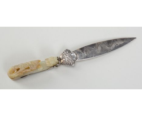 A PALE CELADON JADE 'CHILONG' BELT HOOK MOUNTED IN SILVER AS A LETTER OPENER, 19th CENTURYChina, Qing Dynasty (1644-1912). We