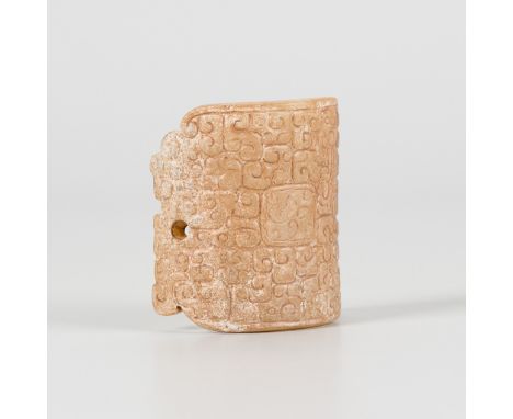A JADE ARC-SHAPED ORNAMENT, EASTERN ZHOU DYNASTY, SPRING AND AUTUMN PERIODChina, 770-221 BC. The convex surface skillfully wo