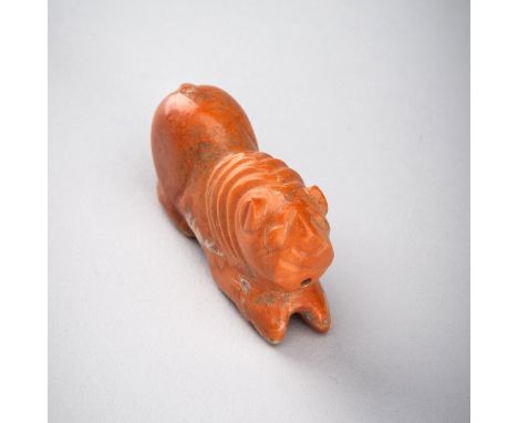 A PYU AGATE 'LION' TALISMAN, 200-1000 ADPyu city states (200-1000 AD). The opaque agate of a reddish-orange color with areas 