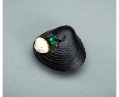 A FINE EBONY WOOD NETSUKE OF A HAMAGURI CLAM WITH INLAYS, 19th CENTURYJapan, 19th centuryThe naturalistically carved clam is 