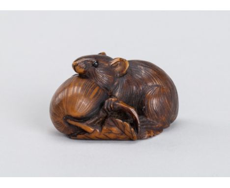 A RARE COROZO NUT NETSUKE OF A RAT ON A GOURDUnsignedJapan, Meiji period (1868-1912)Finely carved, the naturalistically rende