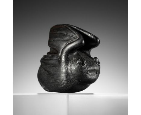 A RARE EBONY WOOD NETSUKE OF A BATUnsignedJapan, 19th century, Edo period (1615-1868)Finely carved in the manner of Horaku to