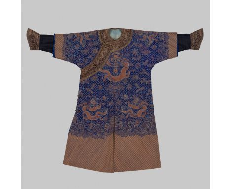 A BLUE-GROUND SILK EMBROIDERED 'DRAGON' ROBE WITH A RED SILK SKIRT, 19TH CENTURYChina, Qing dynasty (1644-1912). Finely woven