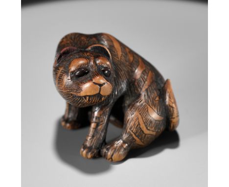 SHIGEKAZU: A FINE WOOD NETSUKE OF A TIGERBy Shigekazu, signed Shigekazu 重一Japan, Tanba Province, 19th century, Edo period (16