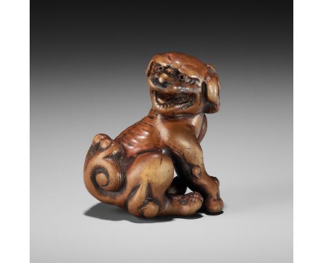 TOMOTADA: A POWERFUL WOOD NETSUKE OF A SNARLING SHISHISigned Tomotada 友忠Japan, Kyoto, late 18th century, Edo period (1615-186