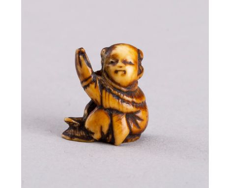 A MARINE IVORY OJIME OF A KARAKO, 19th CENTURYJapan, Edo period (1615-1868)Carved as a karako (Chinese boy) wearing a pattern