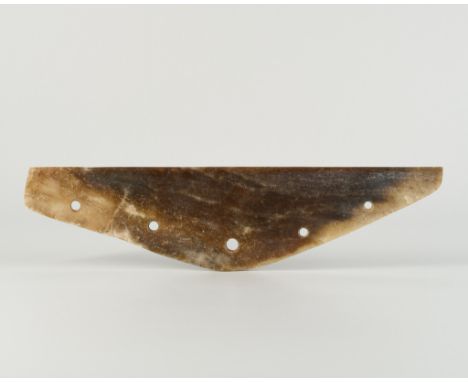 A JADE CEREMONIAL AXE, QIJIA CULTUREChina, Qijia culture, c. 2200-1600 BC. Of triangular form, the stone with gently curved s