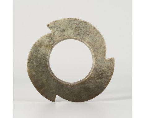 A JADE NOTCHED DISC, LATE NEOLITHIC PERIOD TO SHANG DYNASTYChina, Qijia culture, c. 2200-1050 BC. Of circular form, the jade 