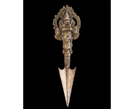 A BRONZE PHURBU WITH YAMANTAKA, 18Th-19TH CENTURYTibet. Finely cast, the tripart ritual dagger issuing from the mouth of a ma