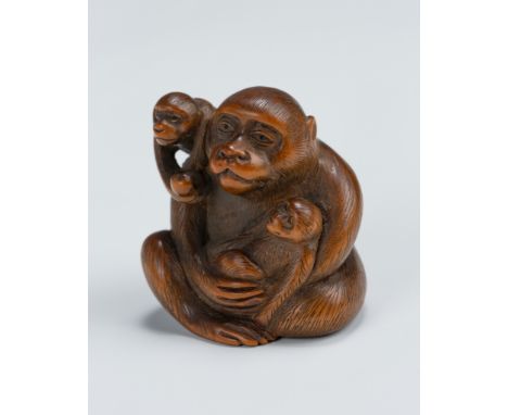 A CHARMING WOOD NETSUKE OF MONKEY WITH TWO YOUNGUnsignedJapan, 19th centuryFinely carved as a small family of monkeys, the mo