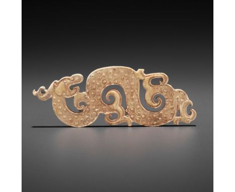 A SMALL JADE PENDANT DEPICTING A COILED DRAGON, EASTERN ZHOUChina, Eastern Zhou, 4th-3rd century BC. Finely carved as a sinuo