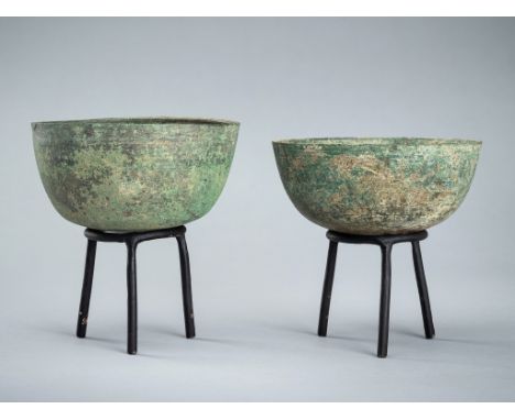 A PAIR OF BRONZE BOWLS, ANGKOR PERIOD, 10TH-12TH CENTURYKhmer Empire. Thinly cast, each bowl resting on a rounded base rising