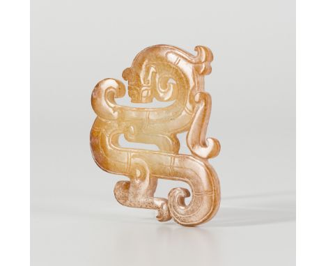 A JADE 'CHILONG' PENDANT, EASTERN ZHOU DYNASTYChina, 770-221 BC. Finely carved, the chilong coiling its body in a dramatic S-