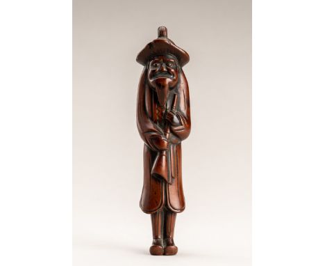 A LARGE WOOD NETSUKE OF A DUTCHMANUnsignedJapan, Meiji period (1868-1912)Well-carved as a standing Dutchman depicted here wea