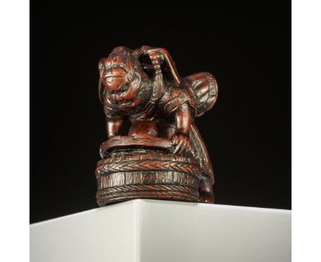 A WOOD NETSUKE OF SHOKI CAPTURING ONIAfter Ittan, inscribed Ittan 一旦 with kakihanJapan, late 19th - early 20th centuryThe dem
