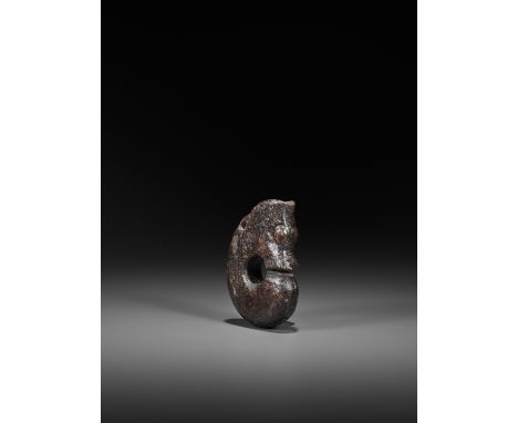A HARDSTONE 'PIG-DRAGON' CARVING, ZHULONG, POSSIBLY HONGSHANChina, possibly Hongshan culture, c. 4000-3000 BC or later. The j