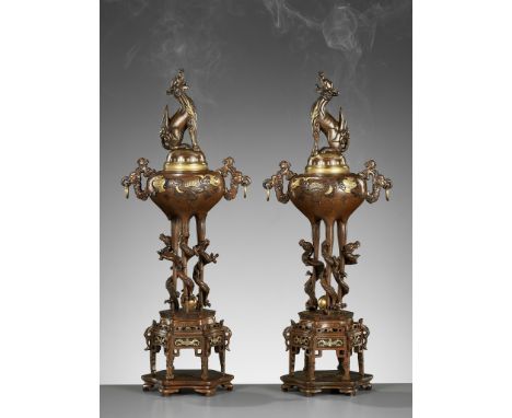 A PAIR OF SUPERB TAKAOKA GOLD-INLAID BRONZE 'MYTHICAL BEASTS' KORO (INCENSE BURNERS) AND COVERSAttributed to Ohashi San'emon 