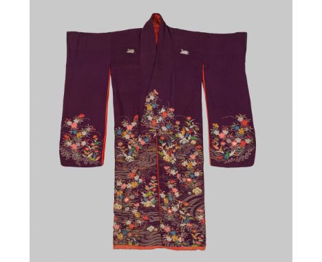 A PURPLE SILK EMBROIDERED KIMONOJapan, 20th century. Finely woven in couched gold threads and satin stitch depicting wildflow