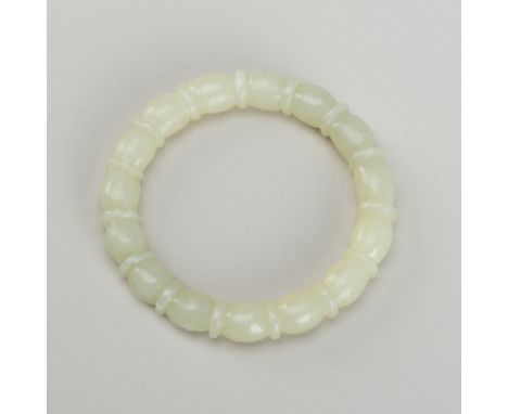 A PALE CELADON JADE BANGLE, LATE QING TO EARLY REPUBLICChina, late Qing dynasty (1644-1912) to early Republic period (1912-19
