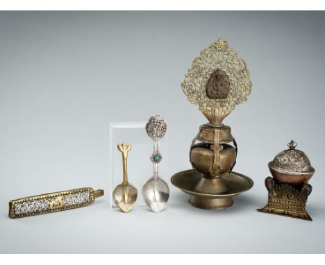 A GROUP OF FIVE TIBETAN RITUAL IMPLEMENTS, 19TH CENTURYTibet. Comprising a small copper kapala, with a silver repousse cover 