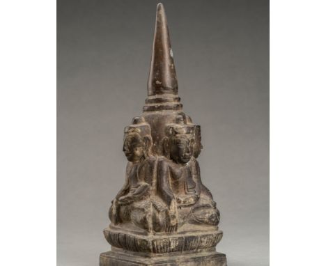 A HEAVY BRONZE STUPA WITH FOUR CARDINAL BUDDHASSoutheast Asia, 19th-early 20th century. Heavily cast, the Buddhas are seated 