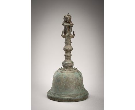 A BRONZE TEMPLE BELL, 17TH CENTURY OR EARLIERJava, 17th century or earlier. The domed bell flaring towards the lip, surmounte