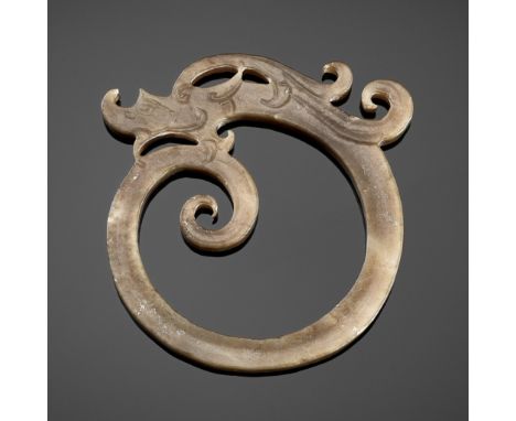 A JADE RING ORNAMENT IN FORM OF A COILED DRAGON, WESTERN HANChina, Western Han, 2nd-1st century BCA fine example of a jade ri