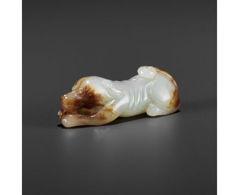 A JADE FIGURE OF A HOUND, QING OR EARLIERChina, Qing dynasty (1644-1912) or earlier. Finely carved as a recumbent dog, its fo