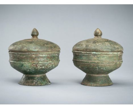 A PAIR OF BRONZE MEDICINE VESSELS AND COVERS, ANGKOR PERIOD, 12TH-13TH CENTURYKhmer empire, 12th-13th century. Finely cast, e