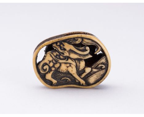 AN ANTLER RYUSA MANJU NETSUKE OF A KIRIN AND PHOENIXJapan, Asakusa, Tokyo, 19th centuryOf irregular form, carved in openwork 