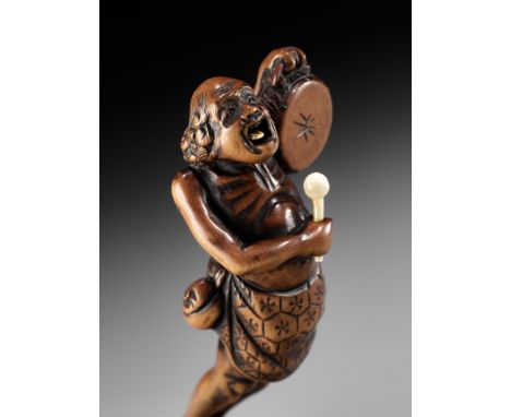 A LARGE WOOD NETSUKE OF A DRUMMING ASHINAGA WITH MOVABLE TONGUEUnsignedJapan, Edo (Tokyo), late 18th to early 19th century, E