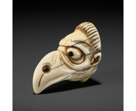 A FINE IVORY MASK NETSUKE OF A KARASU TENGUUnsignedJapan, Osaka, late 18th to early 19th century, Edo period (1615-1868)Finel