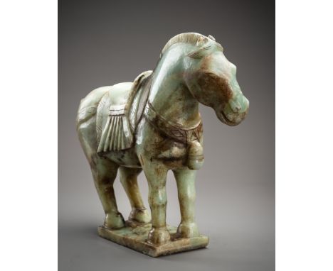 A MASSIVE JADE FIGURE OF A CAPARISONED HORSE, REPUBLIC PERIODChina, Republic period (1912-1949). Standing foursquare on a rec