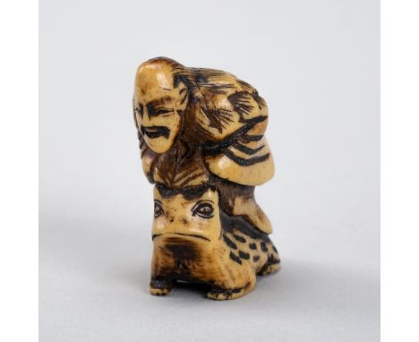 AN ANTLER NETSUKE OF GAMA SENNIN SITTING ON A TOADJapan, Edo period (1615-1868)Humorously carved, the hermit seated on a larg