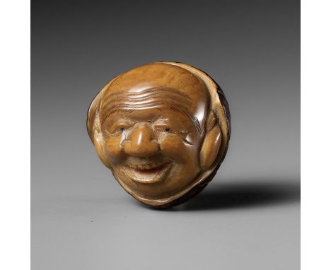 A COROZO NUT NETSUKE OF DAIKOKUBy Gyokuzan, signed Gyokuzan 玉山Japan, 19th centuryA pleasingly tactile and well-carved, staine