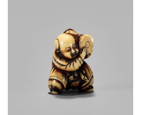 AN ANTLER NETSUKE OF A BOY WITH DRUM, 19th CENTURYJapan, 19th century, Edo period (1615-1868) Finely carved as a karako (Chin