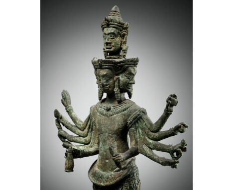 A BRONZE FIGURE OF SADASHIVA, KOH KER STYLE, KHMER EMPIRE, LATE 10TH - 11TH CENTURYStanding on a square plinth in sampada wit