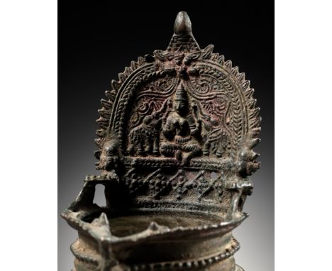 A BRONZE OIL LAMP DEPICTING GAJALAKSHMI WITH ELEPHANTS, SOUTH INDIA, KERALA, 15TH-17TH CENTURYFinely cast, the deep circular 