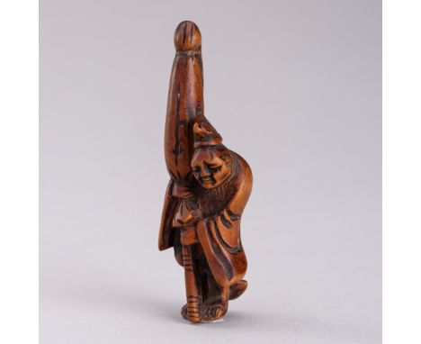 A WOOD NETSUKE OF A SLEEPING TEMPLE SERVANT, EDO PERIODJapan, 19th century, Edo period (1615-1868) Carved as a temple servant