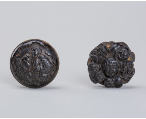 A SET OF TWO PRESSED HORN MANJU NETSUKEUnsignedJapan, Meiji period (1868-1912)The first carved in relief depicting an actor w