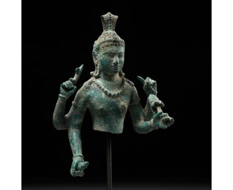 A KHMER BRONZE BUST OF LOKESHVARA, BAYON STYLE, ANGKOR PERIODKhmer Empire, 12th century. The four-armed figure is finely cast