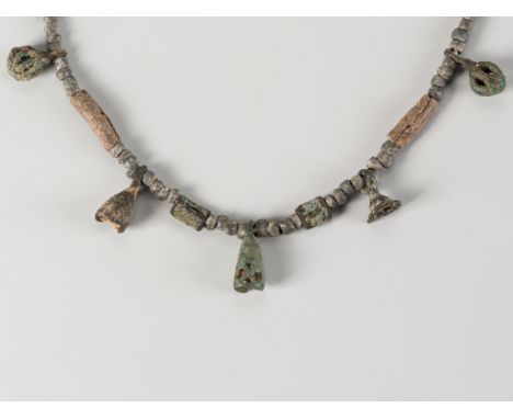 A KHMER STONE AND BRONZE NECKLACE, 8TH - 10TH CENTURYCambodia, 8th - 10th century or earlier. The necklace comprising various