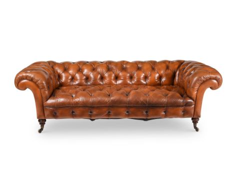 A VICTORIAN WALNUT AND LEATHER UPHOLSTERED CHESTERFIELD SOFA BY HOWARD & SONS, LATE 19TH CENTURY One back leg stamped '1768 2