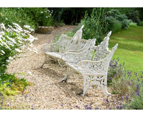 TWO WEATHERED CAST IRON GARDEN BENCHES  20TH CENTURY  First in the Coalbrookdale Gothic pattern, 151.5cm wide, 96.5cm high, 5
