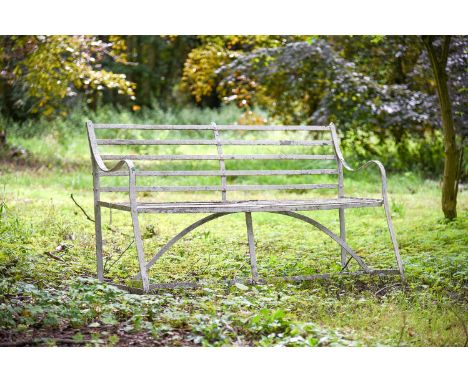 A REGENCY IRON STRAPWORK BENCH  EARLY 19TH CENTURY  152cm wide, 85.5cm high, 57cm deep at the pad feet    Condition Report:  