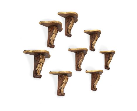 A SET OF EIGHT PARCEL GILT WALNUT WALL BRACKETS  LATE 19TH CENTURY  Each with serpentine softwood top on leaf carved scroll b