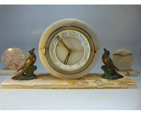 Marble and Alabaster Art Deco mantle clock with bronzed Spelter birds either side. Clock with circular Garniture. 